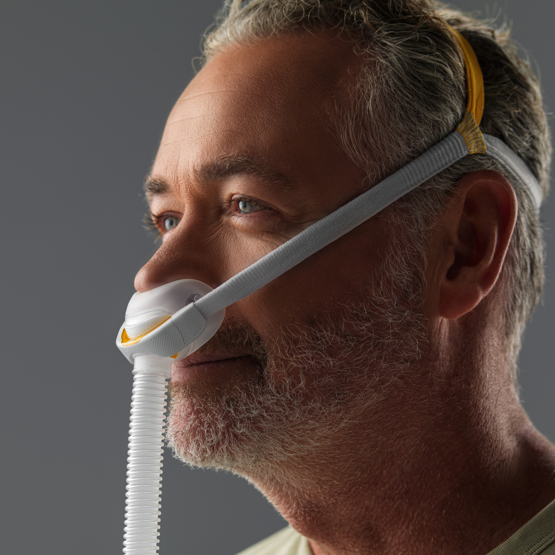 man wearing the fisher & paykel solo pillow mask