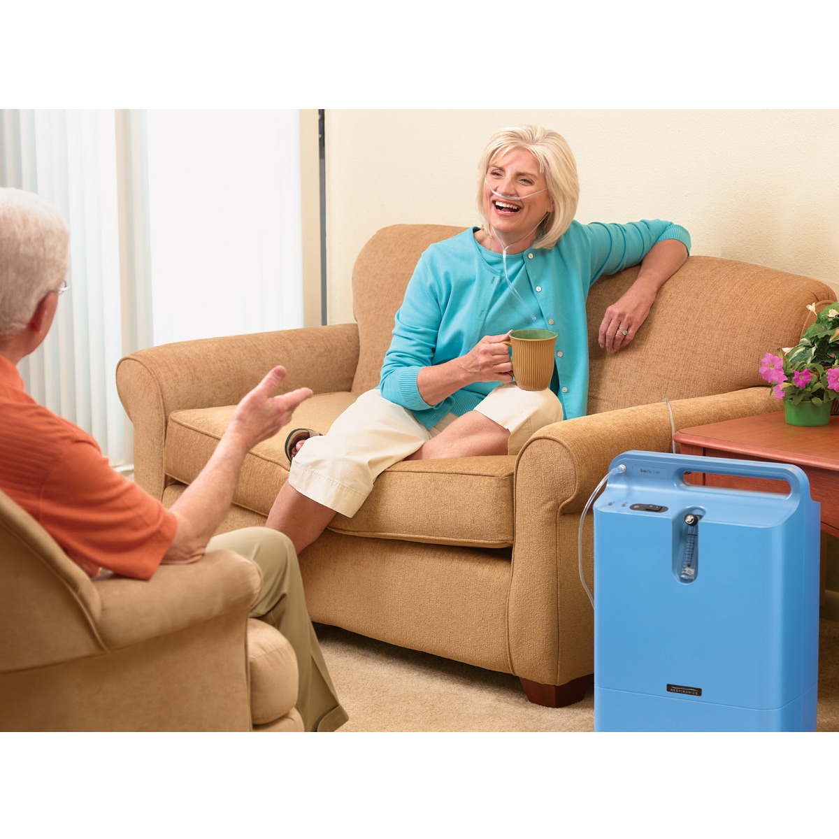Woman using the Philips Respironics EverFlo Oxygen Concentrator